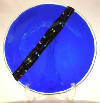 Cobalt blue art glass bowl with a slice of kiln fused color bar